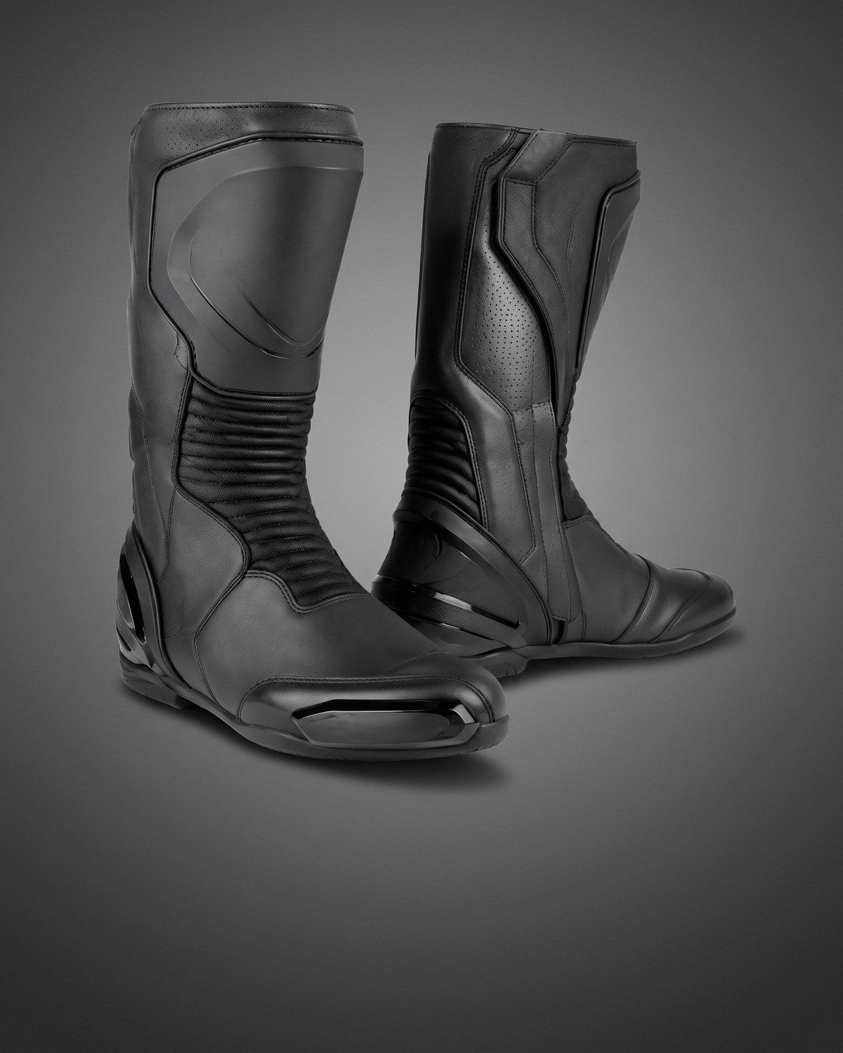 Graphite Stealth racing boots on a charcoal studio gradient