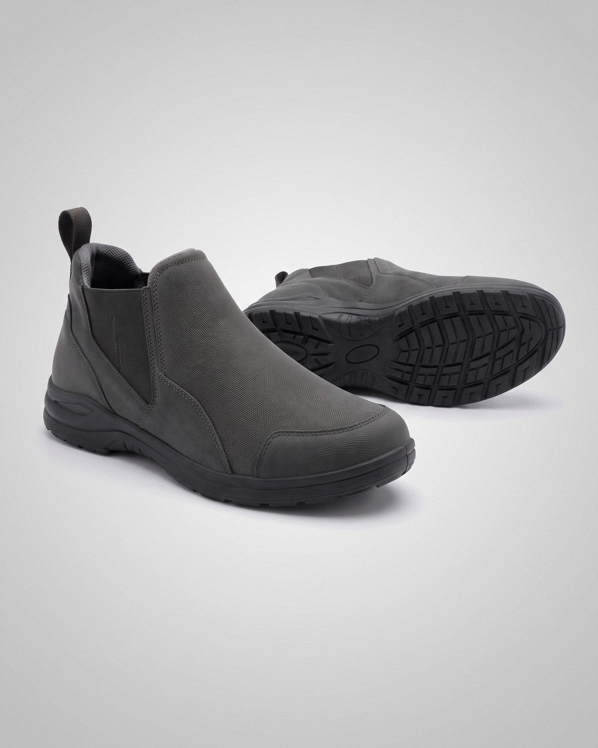 Graphite Link slip-on riding shoes on a light studio gradient