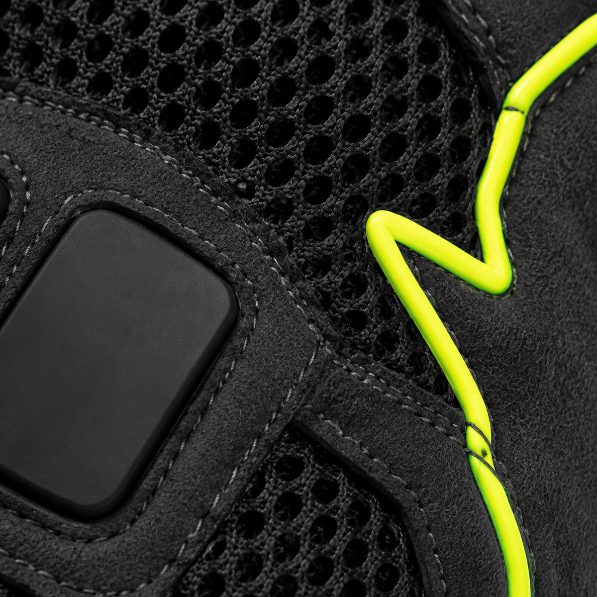 Close-up of NightPulse hex mesh, knuckle tile and reflective lime piping