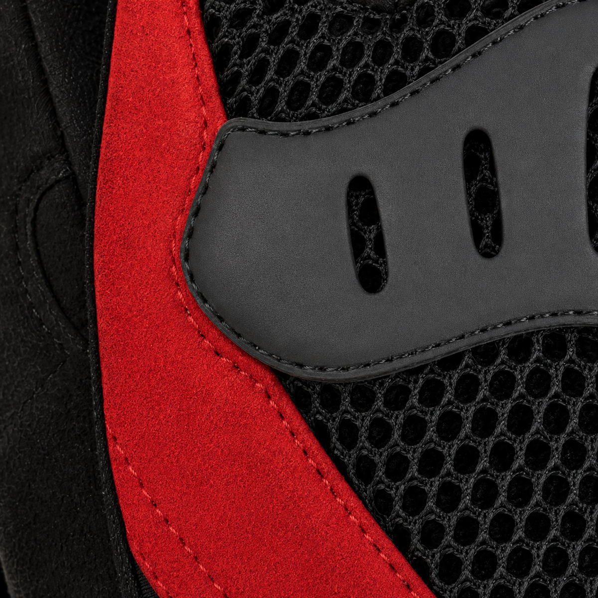 Close-up of Velocity Air slotted knuckle bridge, red overlay and hex mesh